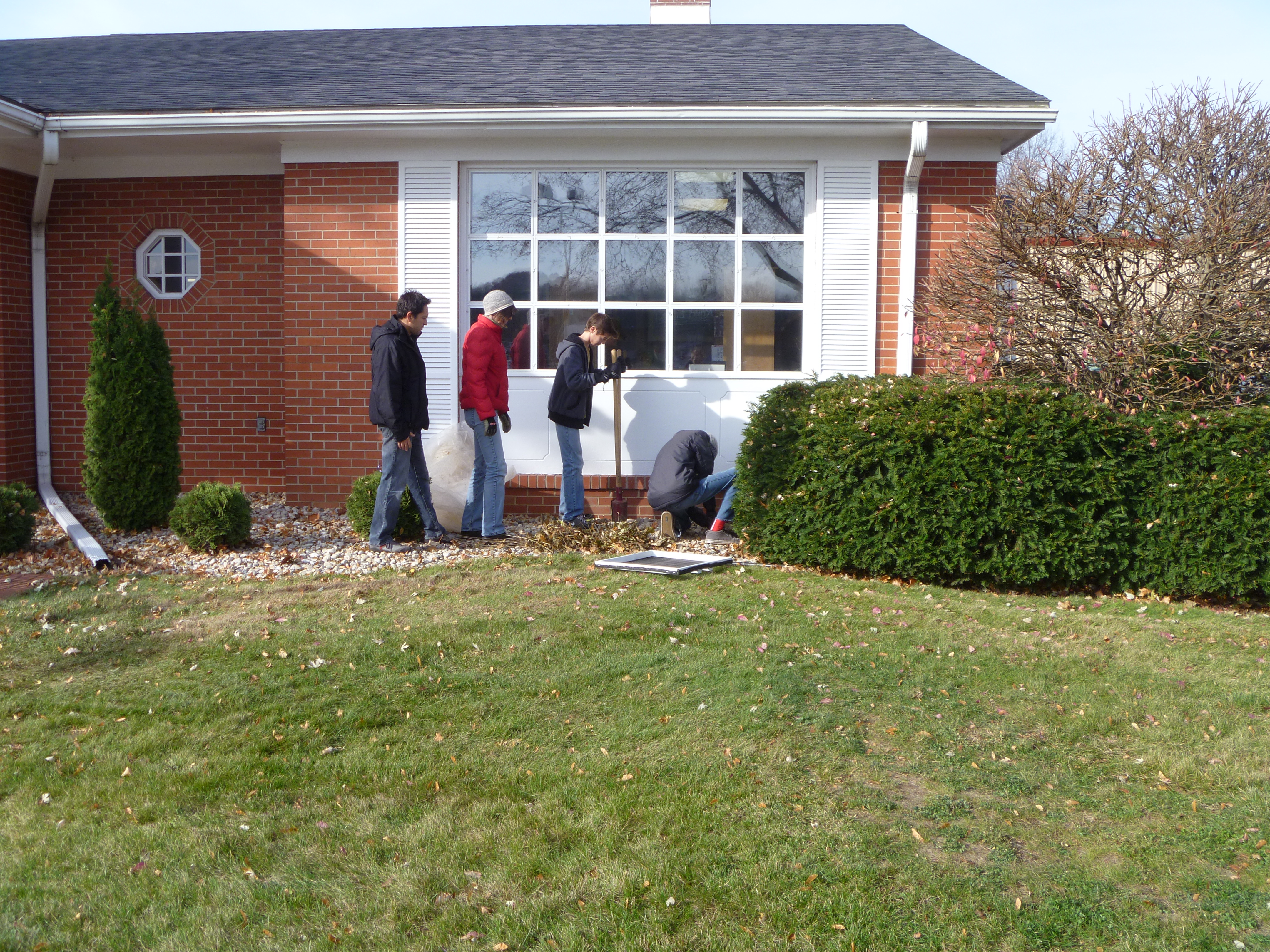 Setting up a bird feeder at the Sauk City Library